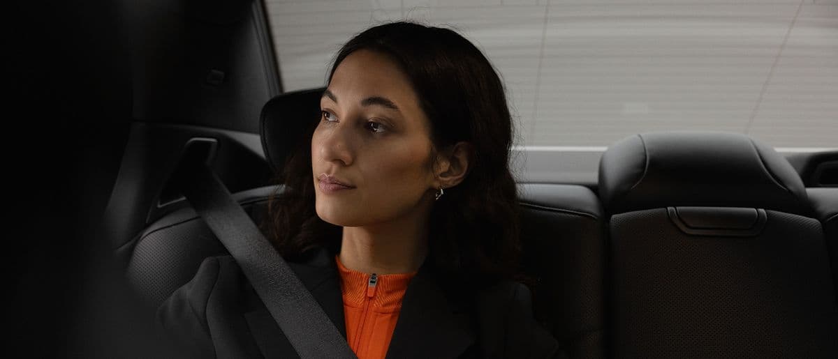 Businesswoman in the back seat of a limousine