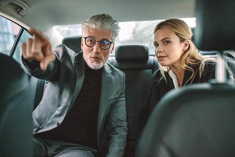 Two businesspeople traveling by la vip car services