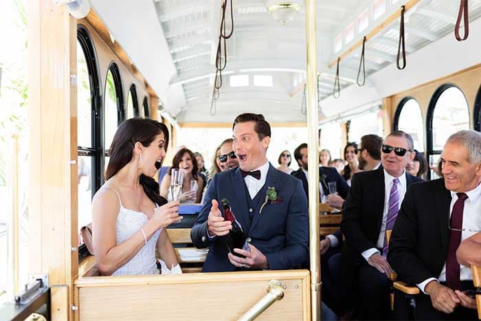 Couple-taking-first-toast-on-trolley