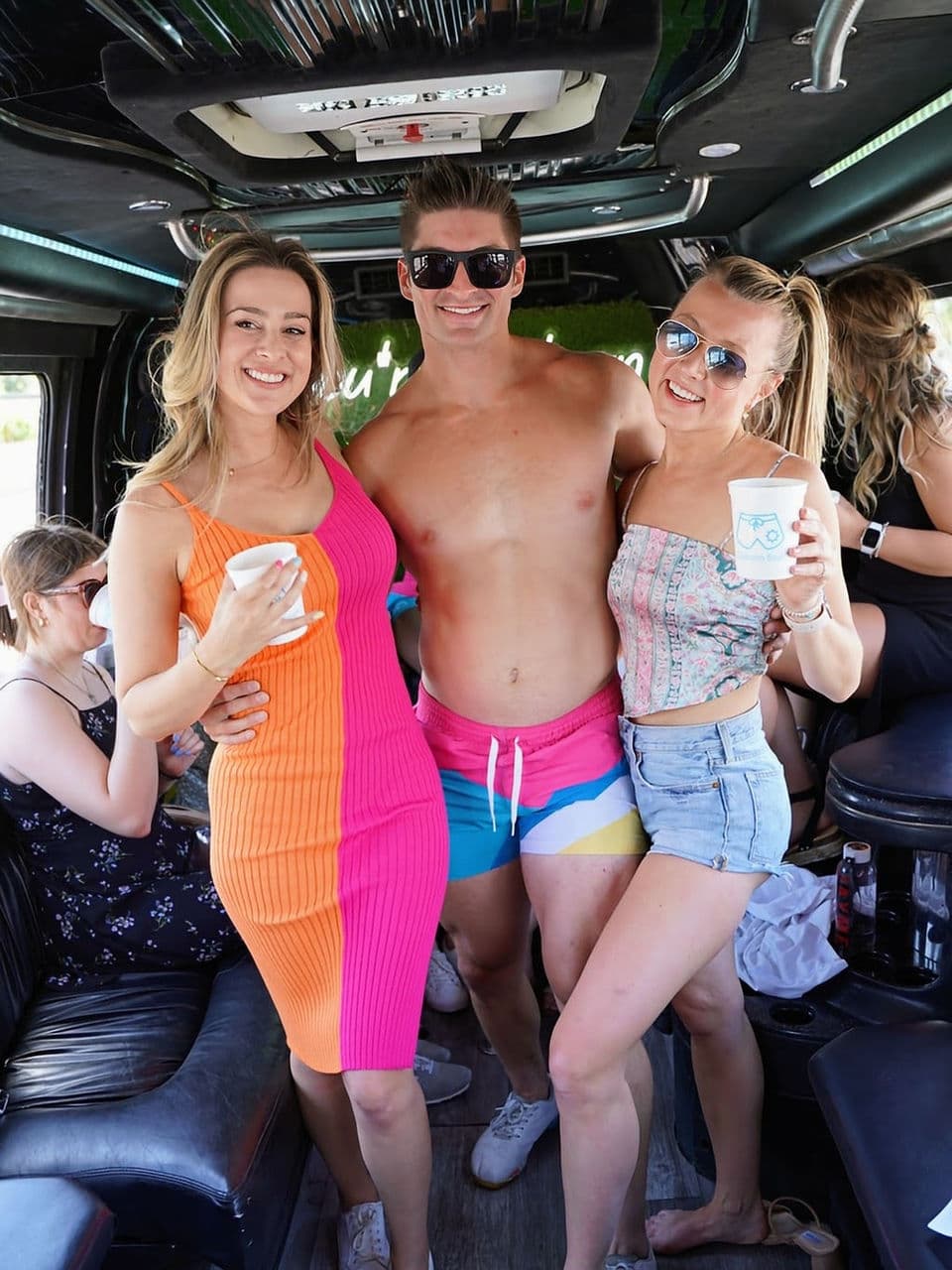 Party bus: women and man smiling, Scottsdale Bachelorette Demo