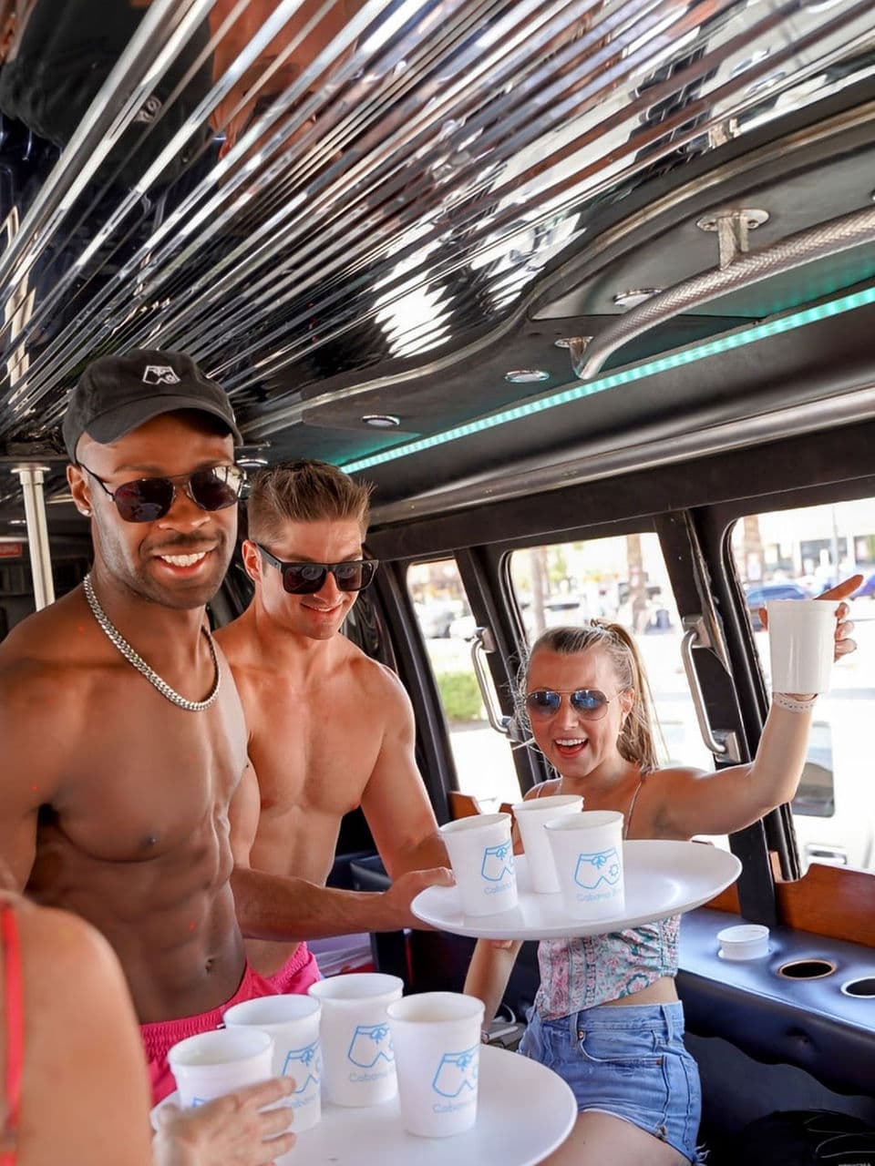 Group enjoys drinks on party bus
